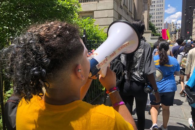 Students, teachers, and other activists march in June to protest school safety officers.